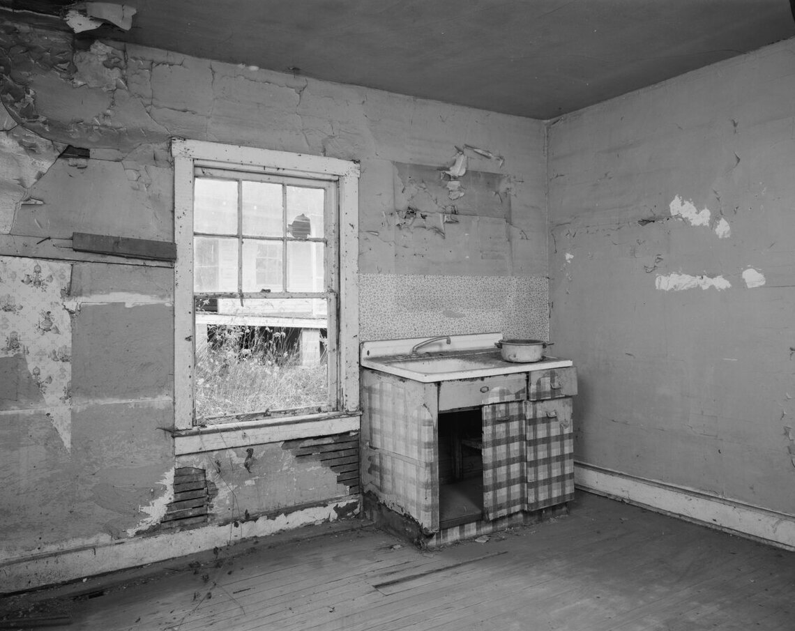 Old kitchen with peeling walls